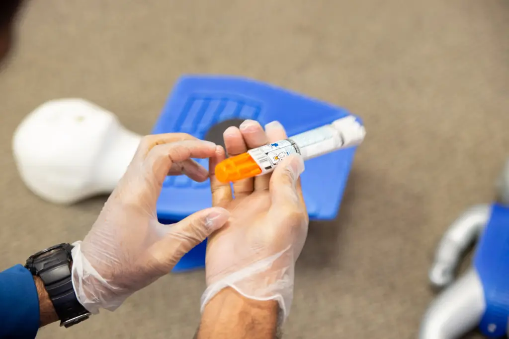 staff training to inject an epinephrine as first aid